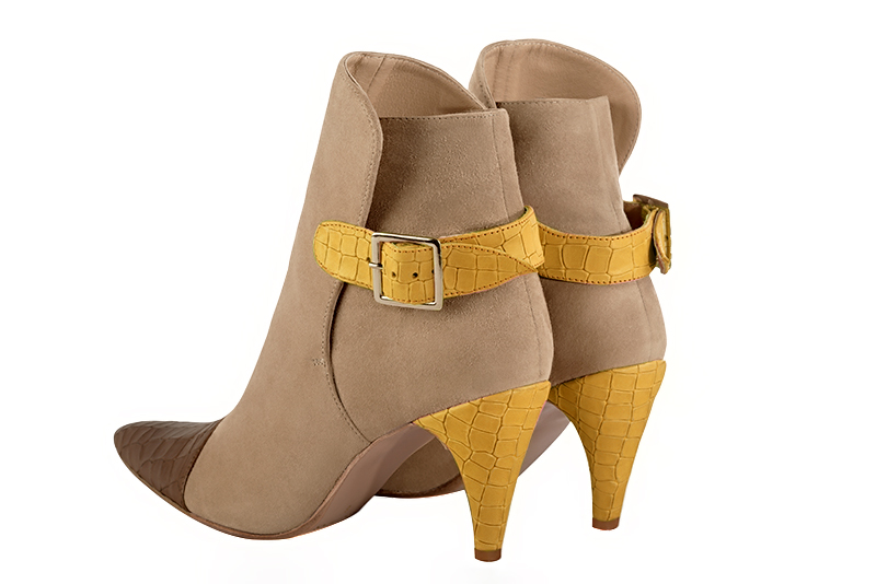 Caramel brown, tan beige and mustard yellow women's ankle boots with buckles at the back. Tapered toe. High slim heel. Rear view - Florence KOOIJMAN